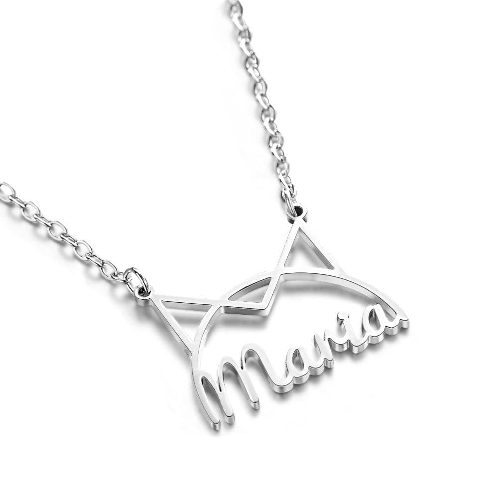 Close-up of a silver-tone Maria pendant with a cat-ear outline