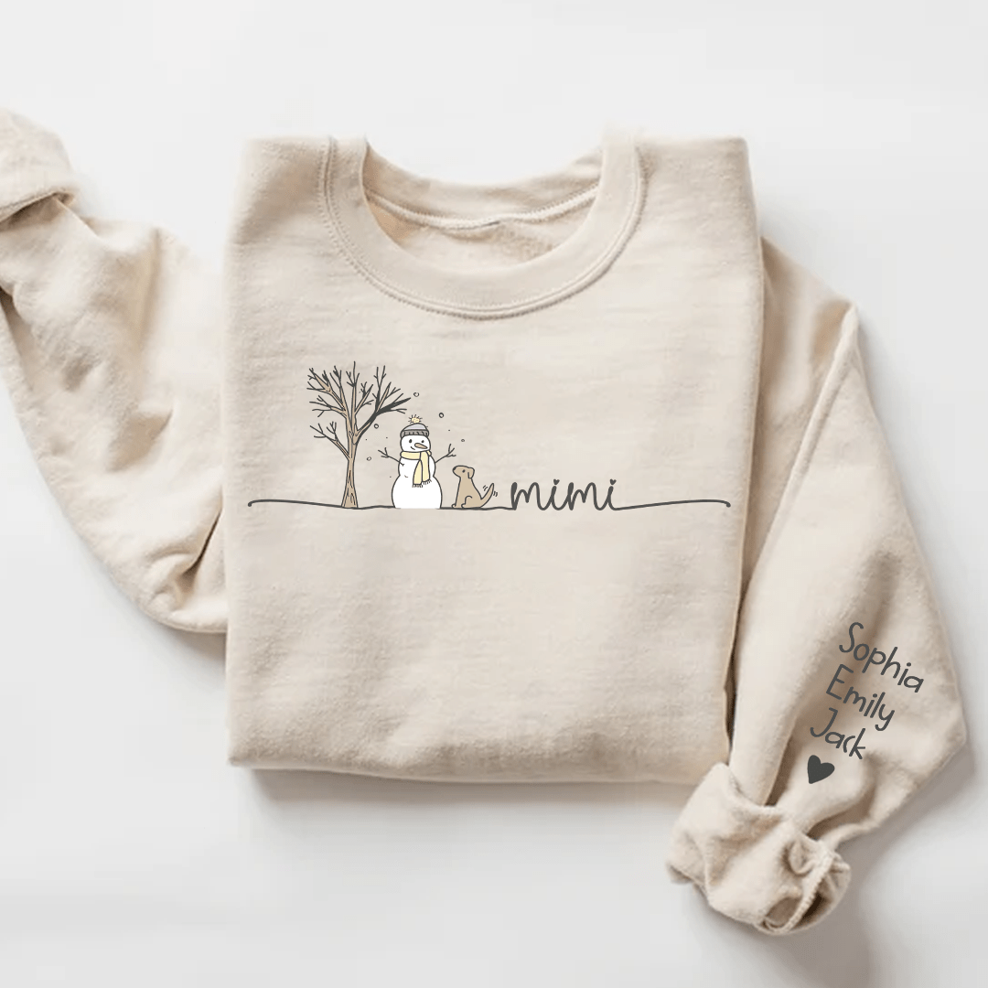 Beige sweatshirt with a snowman, tree, Mimi lettering and personalized names on the sleeve