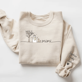 Beige sweatshirt with a snowman, tree, Mimi lettering and personalized names on the sleeve