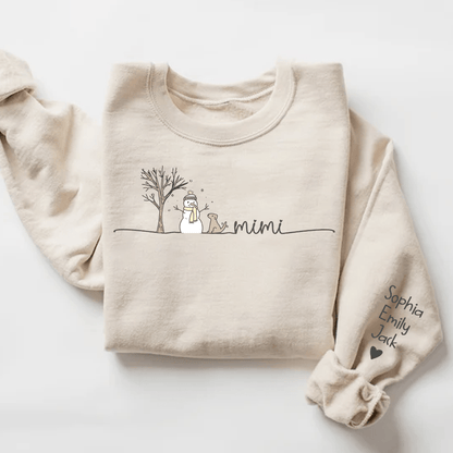 Beige sweatshirt with a snowman, tree, Mimi lettering and personalized names on the sleeve